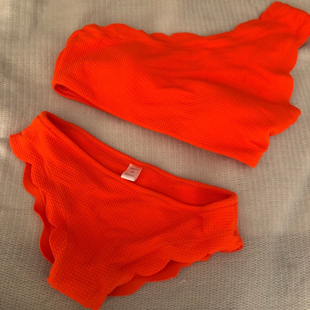 Scalloped, one shoulder bright orange swimsuit